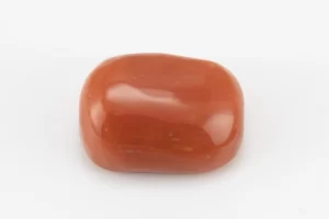 Moonga Stone 6.48 Ratti - Red Coral Stone showcasing vibrant red color and oval-capsule cut