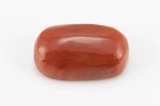 Moonga Stone 7.03 Ratti - Red Coral Stone showcasing vibrant red color and oval-round cut
