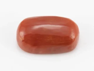 Moonga Stone 7.03 Ratti - Red Coral Stone showcasing vibrant red color and oval-round cut