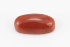 Moonga Stone 7.34 Ratti - Red Coral Stone showcasing vibrant red color and oval-round cut