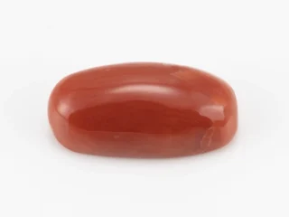 Moonga Stone 7.34 Ratti - Red Coral Stone showcasing vibrant red color and oval-round cut