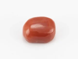 Moonga Stone 7.41 Ratti - Red Coral Stone showcasing vibrant red color and oval-capsule cut