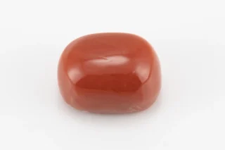 Moonga Stone 7.54 Ratti - Red Coral Stone showcasing vibrant red color and oval-capsule cut