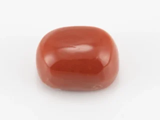 Moonga Stone 7.54 Ratti - Red Coral Stone showcasing vibrant red color and oval-capsule cut