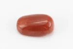 Moonga Stone 7.80 Ratti - Red Coral Stone showcasing vibrant red color and oval-capsule cut
