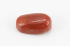 Moonga Stone 7.80 Ratti - Red Coral Stone showcasing vibrant red color and oval-capsule cut