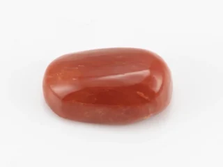 Moonga Stone 7.80 Ratti - Red Coral Stone showcasing vibrant red color and oval-capsule cut