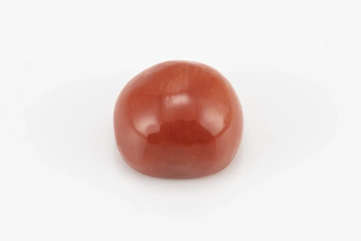 Moonga Stone 7.79 Ratti - Red Coral Stone showcasing vibrant red color and oval-capsule cut