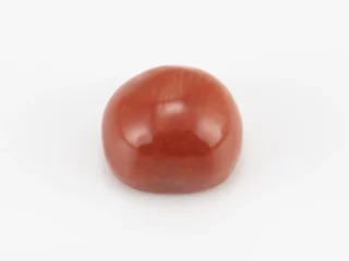 Moonga Stone 7.79 Ratti - Red Coral Stone showcasing vibrant red color and oval-capsule cut