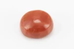 Moonga Stone 8.02 Ratti - Red Coral Stone showcasing vibrant red color and oval-round cut