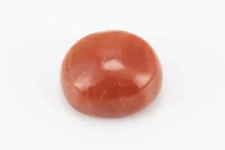 Moonga Stone 8.02 Ratti - Red Coral Stone showcasing vibrant red color and oval-round cut