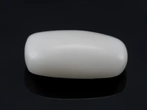 Front view of 5.45 Ratti White Coral Stone​ 4.96 Carat showcasing its smooth texture and natural luster.