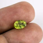 Natural Peridot Stone 2.09 Carat (2.30 Ratti) - In Palm