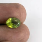 Natural Peridot Stone 3.64 Carat (4.00 Ratti) - In Palm