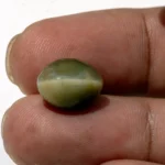 Natural Quartz Cat’s Eye Gemstone (Lahsuniya Ratna) – 7.60 Carat (8.35 Ratti) - in palm