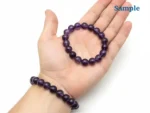amethyst bracelet held in palm for size reference