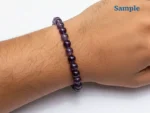 wearing a natural amethyst bracelet on wrist