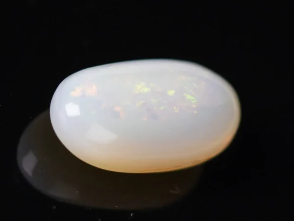 Side view of an Australian Fire Opal 4.64 Carat (5.10 Ratti)