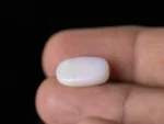 Holding a certified 5.19 Carat (5.70 Ratti) Australian Fire Opal