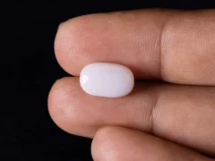 Australian Opal (Shukra) 4.32 Carat (4.75 Ratti), Oval, 14.4mm x 9.1mm x 4.7mm in Hand