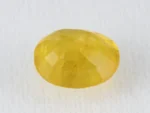 Back view of a 4.69 ratti natural yellow sapphire