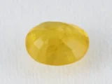 Back view of a 4.69 ratti natural yellow sapphire