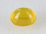 Back view of a 5.12 ratti natural yellow sapphire
