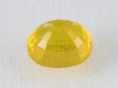 Back view of a 5.12 ratti natural yellow sapphire