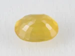 Back view of a 5.18 ratti natural pukhraj gemstone