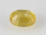 Back view of a 5.36 ratti natural yellow sapphire