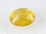 Back view of a 5.38 ratti natural yellow sapphire