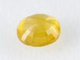Back view of a 5.38 ratti natural yellow sapphire