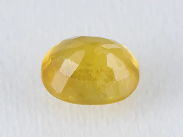 Back view of a 5.45 ratti natural yellow sapphire