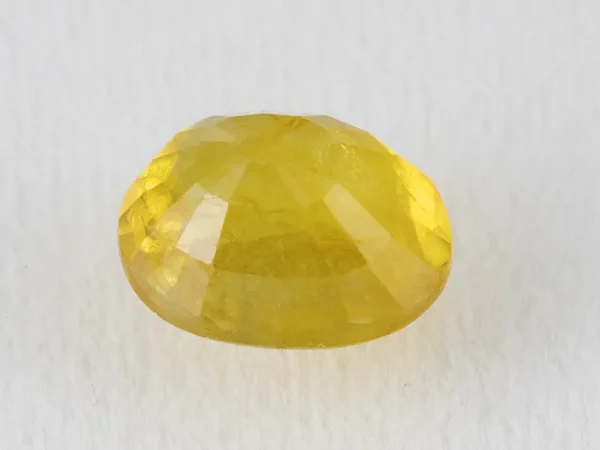 Back view of a 5.49 ratti natural yellow sapphire