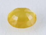 Back view of a 5.77 ratti natural yellow sapphire