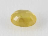 Back view of a 5.90 ratti natural yellow sapphire