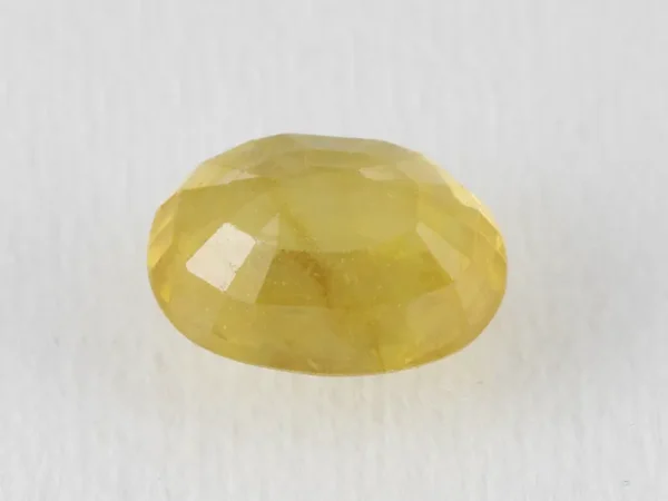 Back view of a 5.90 ratti natural yellow sapphire