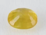 Back view of a 6.18 ratti natural yellow sapphire