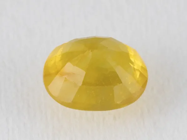 Back view of a 7.29 ratti natural yellow sapphire