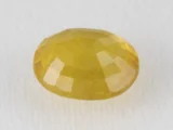 Back view of a 7.54 ratti natural pukhraj gemstone