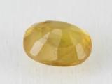 Back view of a 7.63 ratti natural pukhraj gemstone