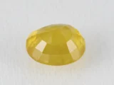 Back view of a 7.68 ratti natural yellow sapphire