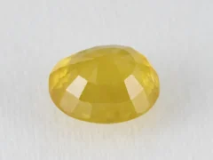 Back view of a 7.68 ratti natural yellow sapphire