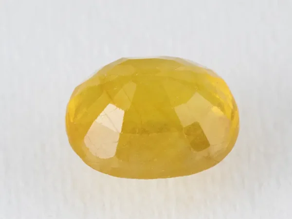 Back view of a 8.59 ratti natural pukhraj gemstone
