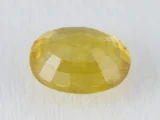 Back view of an 8.96 ratti natural yellow sapphire