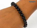 Wearing a black natural quartz bracelet on wrist