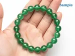 natural green aventurine bracelet held in palm