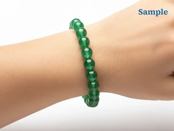wearing a green aventurine bracelet on wrist