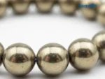 Close-up detail of natural golden pyrite beads