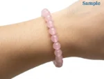wearing rose quartz bracelet on wrist